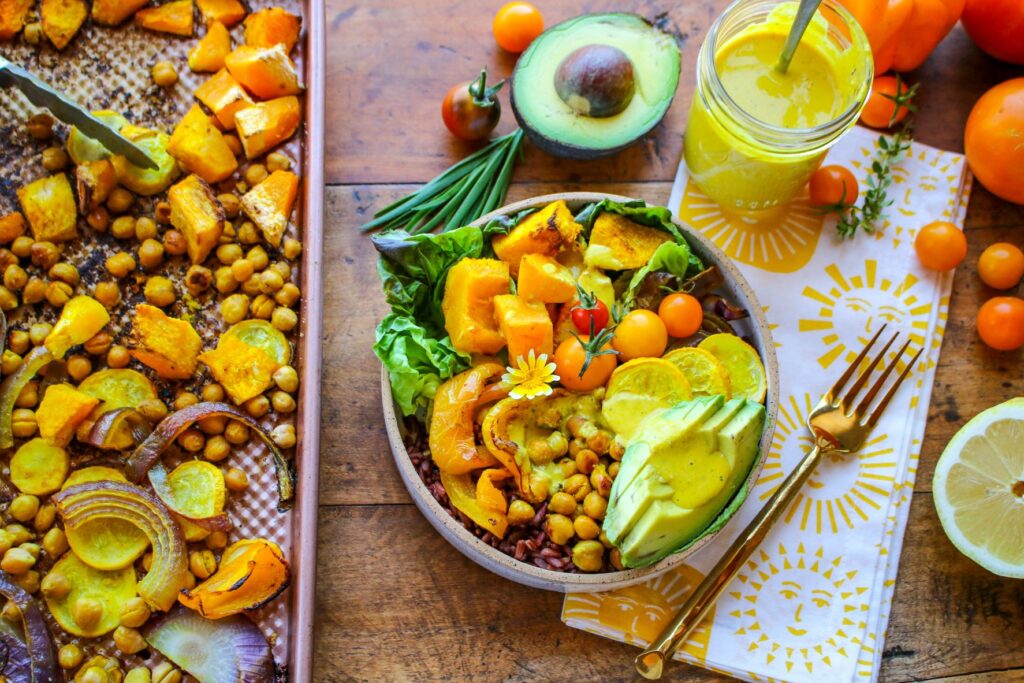 Golden Vegan Glow Bowl with Squash, Chickpeas & Turmeric Dressing…